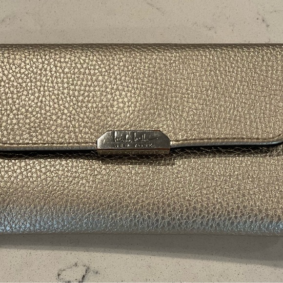 Nicole by Nicole Miller Handbags - Nicole Miller Gold wallet w/animal print interior. Zipper on outside & inside.